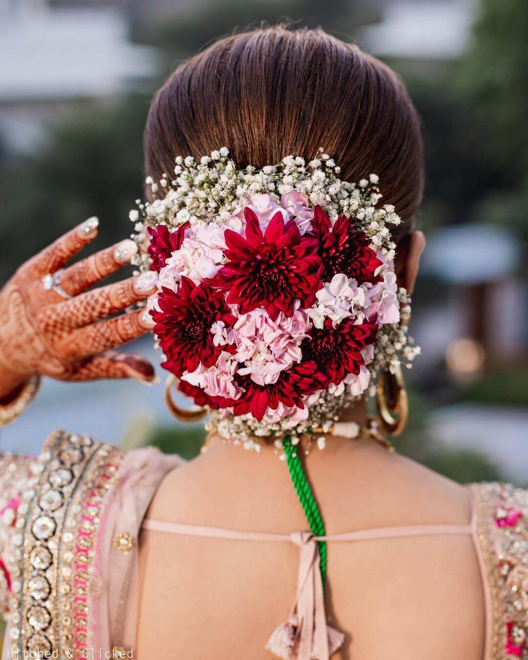 Red, Pink, And Gypsies, Floral Bun Hairstyle For Bride On Her Special Day