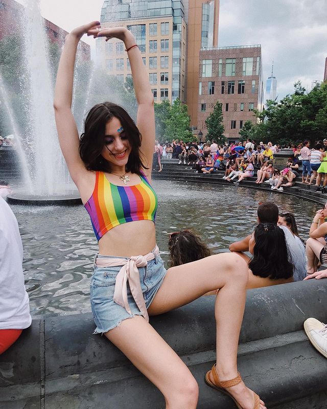 Stunning Babe In Cool And Sassy Rainbow Print Top And Blue Denim Shorts