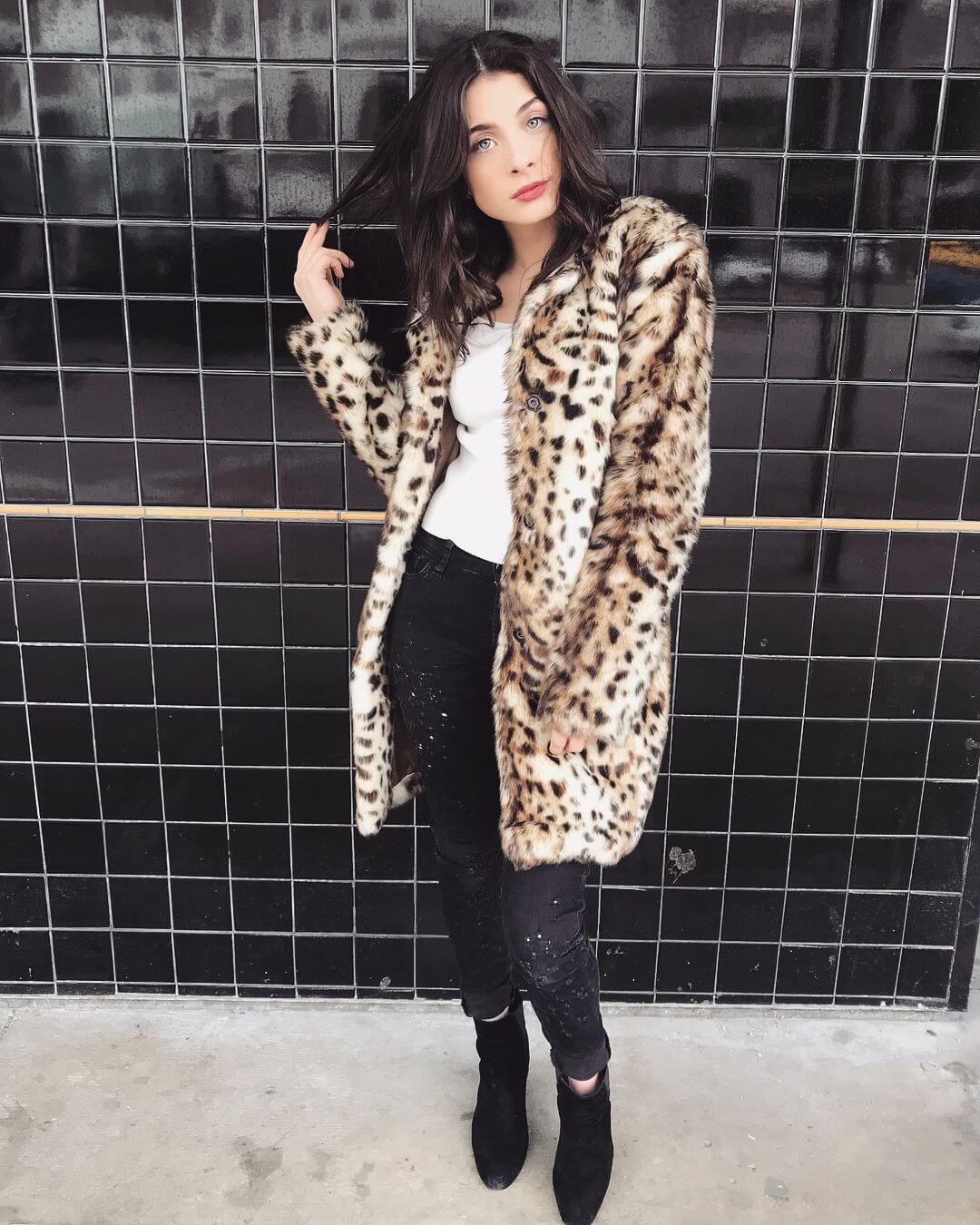 Stunning Niki In White Tee And Denim Jeans Topped With Animal Print Long Jacket
