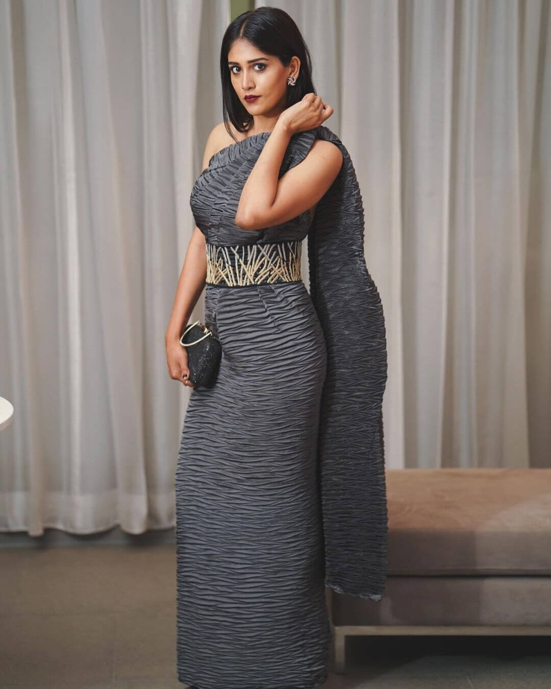 Chandini Chowdary Look Dazzling In Grey Shoulder Long Gown With Black Clutch