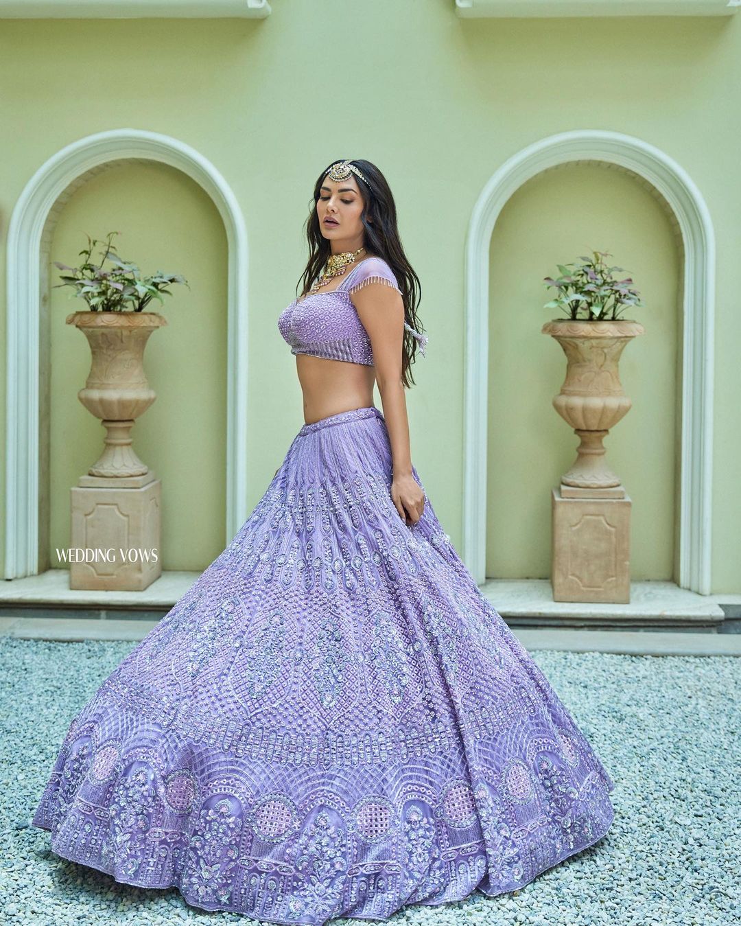 Esha Gupta's Eye-Catching Look In Purple Colored Heavy Embroidered Lehenga