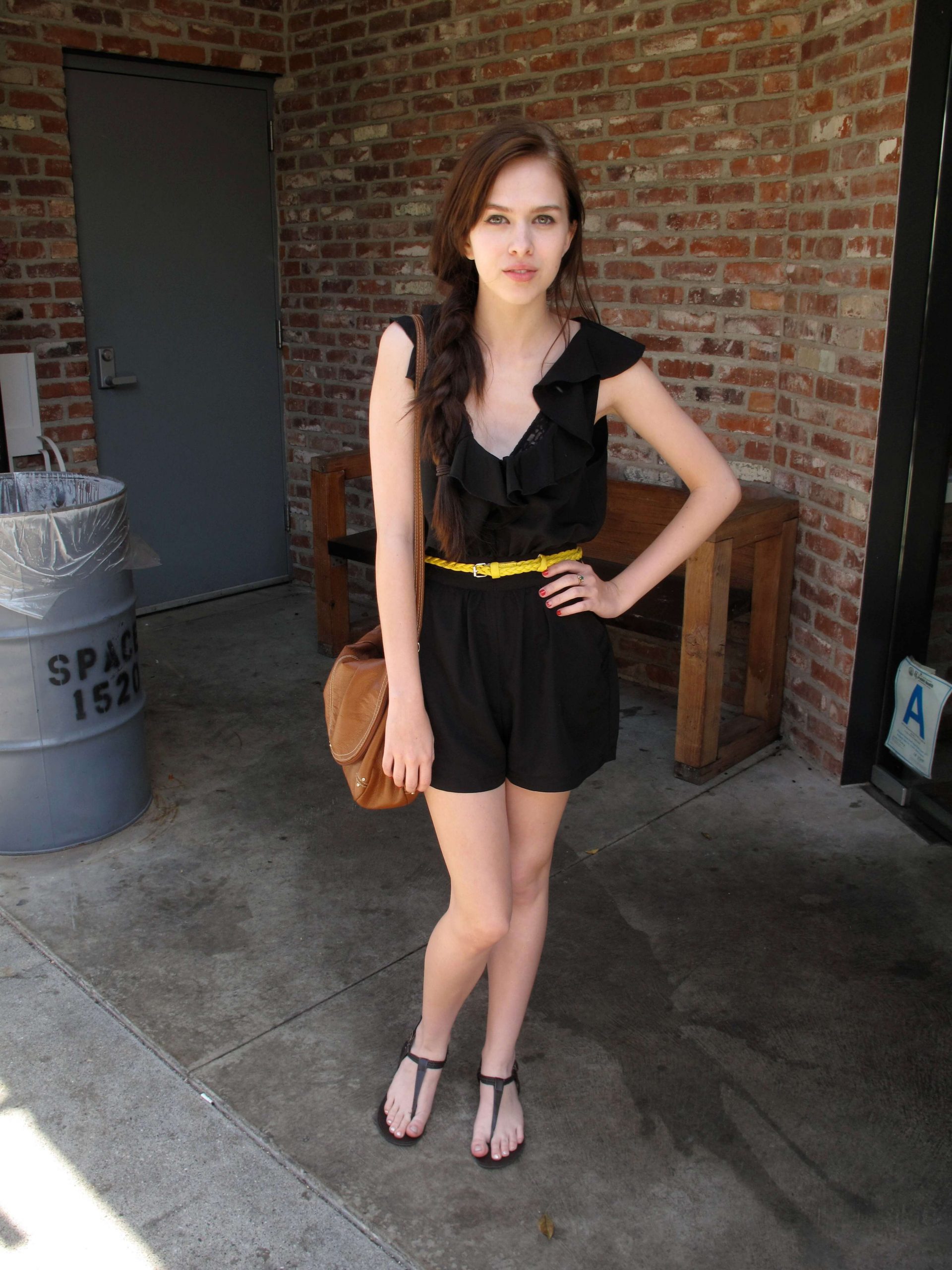 Sassy Babe In Mini Black Dress Accessorized With Yellow Belt On Waist