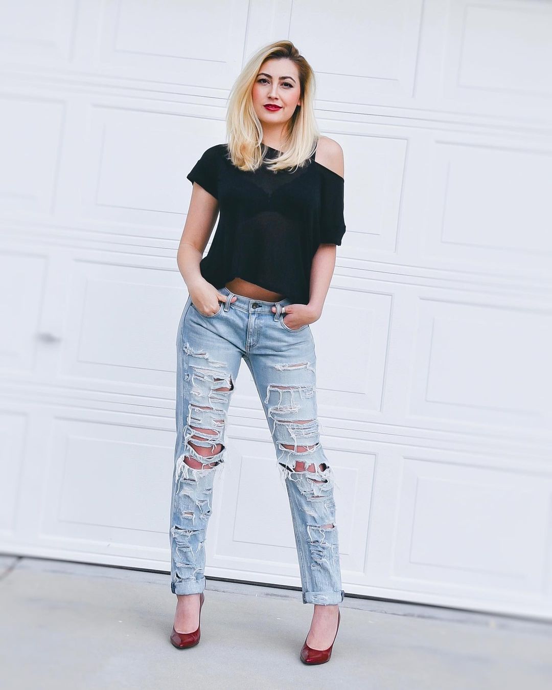 Sassy Babe In One-Shouldered Black Tee Paired With Ripped Denim Jeans