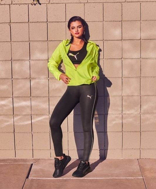 Selena Gomez In Puma Featured Black Co-ord Set Topped With Neon Green Jacket