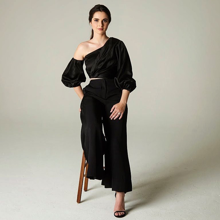 Stunning Vanessa In Black Colored Wrap Top Paired With Matching Black Pants vanessa marano