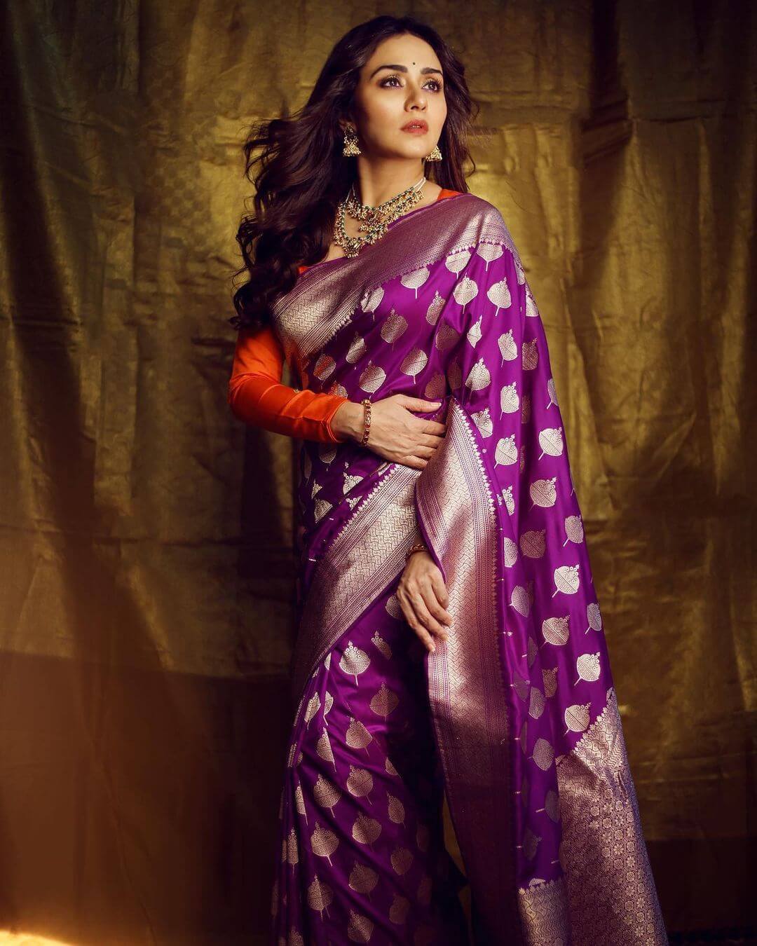 Amruta Khanvilkar Looking Chic In Purple Saree With Orange Full Sleeves Blouse