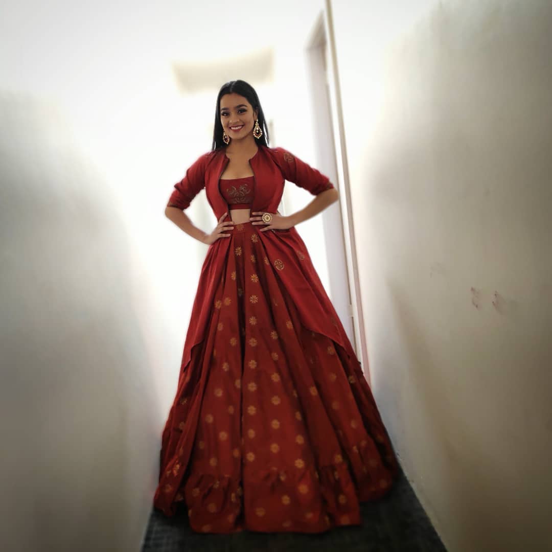 Gayathrie Shankar Bewitching Look In Red Lehenga With Jacket Outfit