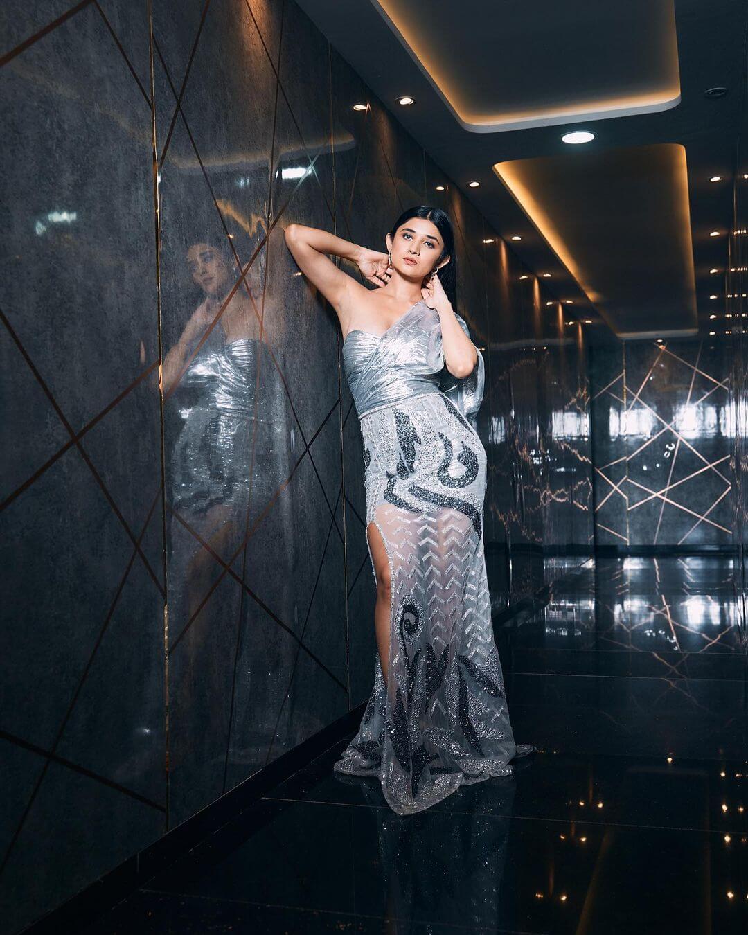 Kanika Mann Dazzling Look In White Shimmery Slit Cut Evening Dress