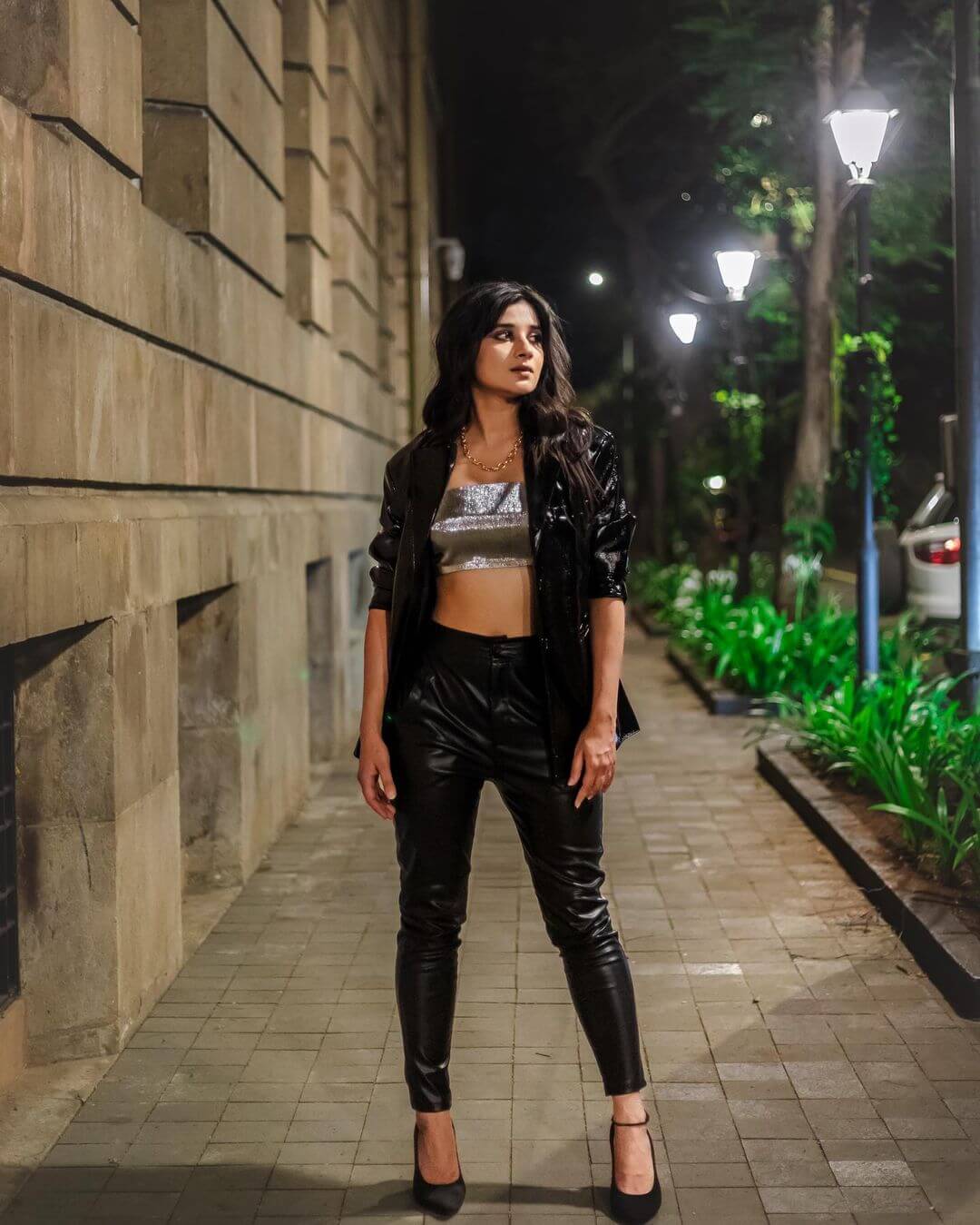 Kanika Mann In Black Leather Pants With Sliver Tube Top & Leather Jacket Outfit