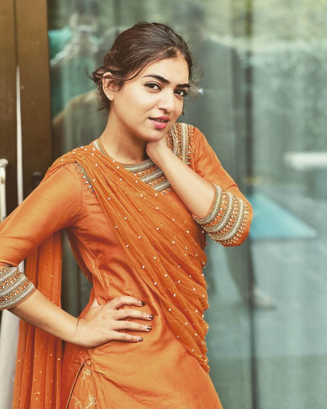 Nazriya Nazim in Orange Salwar suit With heavily Embellished neck detailing