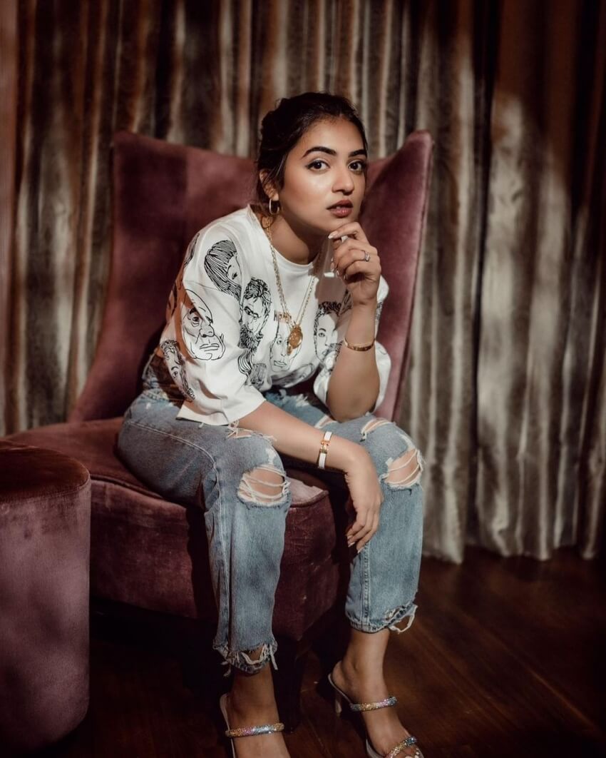 Nazriya Nazim wearing a casual white T-shirt with ripped jeans