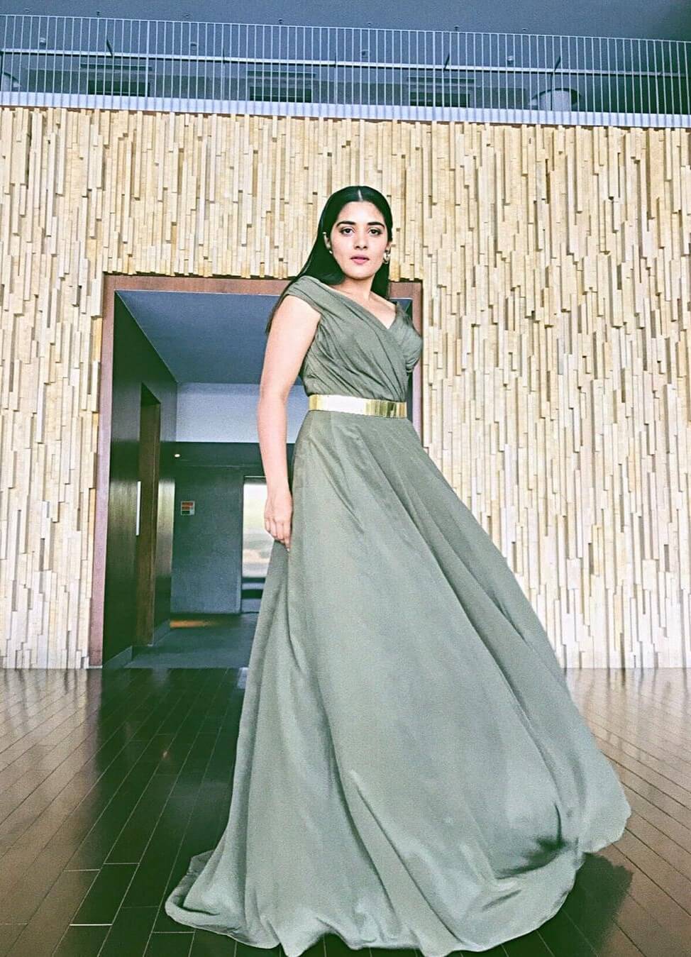 Nivetha Thomas Stunning  Look In Long Gown With Golden Belt
