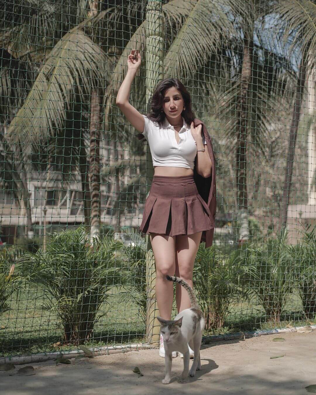 Parul Gulati In Short Platted Skirt With White Polo Neck Crop Top