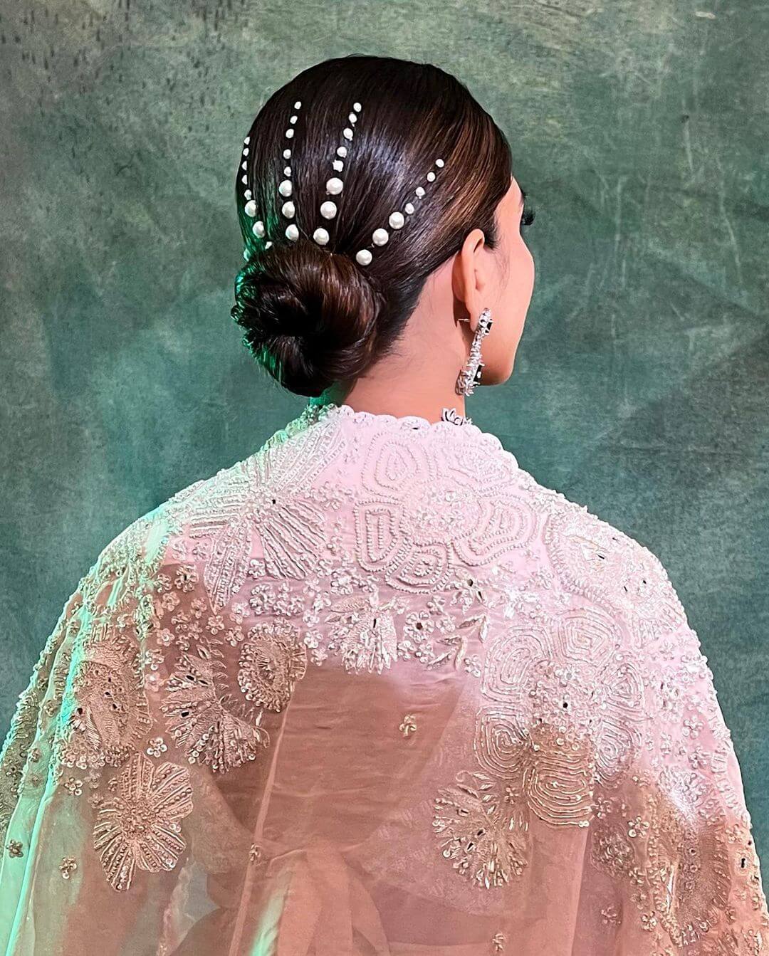 Something New In Its Own Way Indian Bridal Bun Hairstyle With Pearl For Wedding