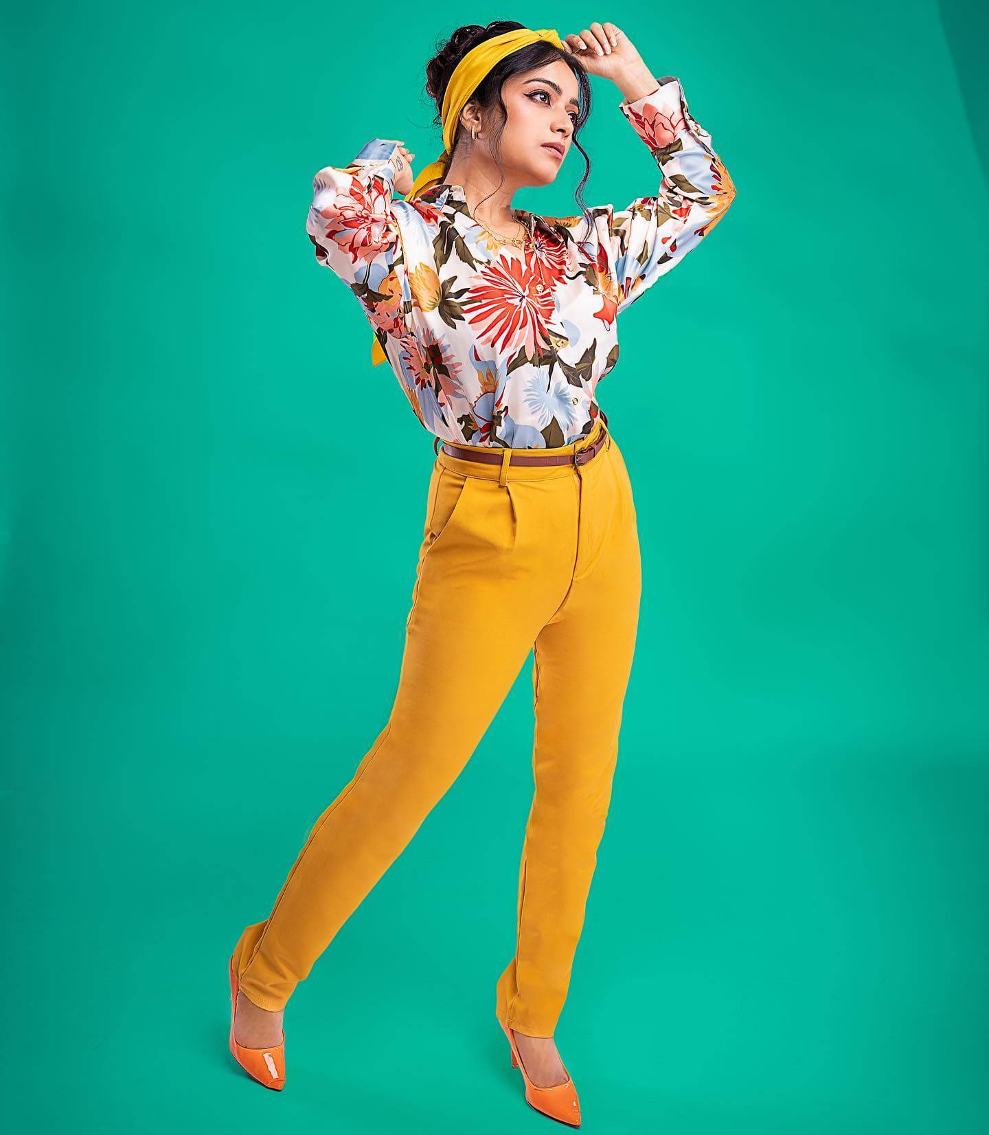 Janani Iyer Gives Us Retro Vibes In Floral Print Shirt Paired With Yellow Slim Fit Pants With Yellow Head Band