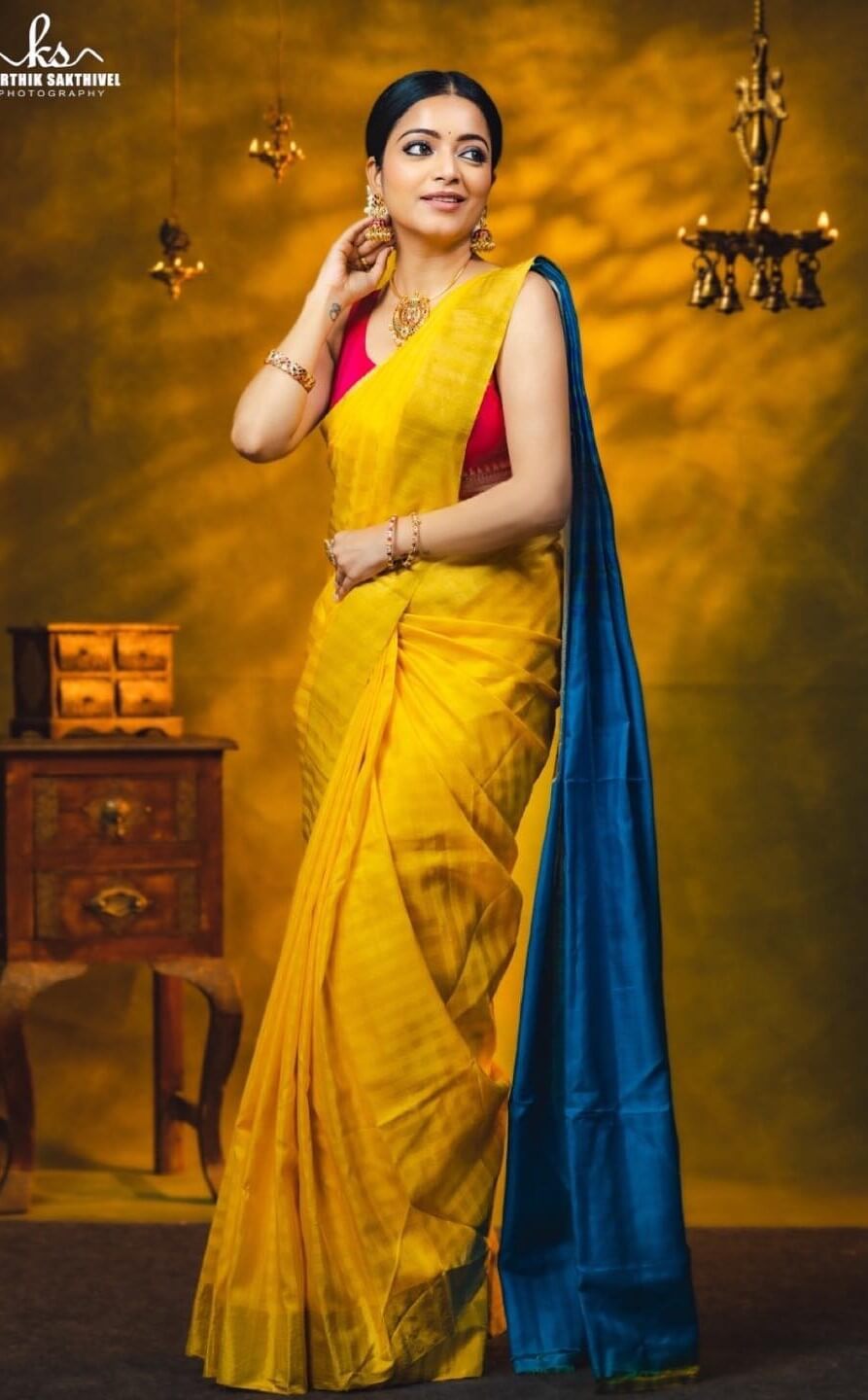 Janani Iyer In Yellow & Blue Saree Paired With Sleeveless Pink Blouse