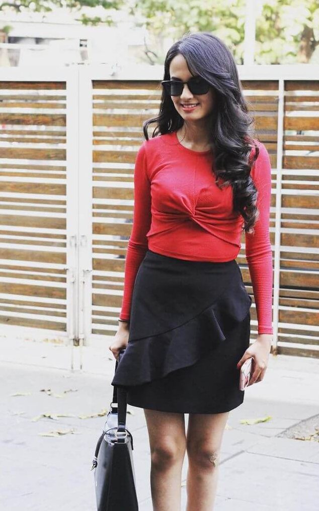 Ketaki Mategaonkar In Red Fullsleeves Top With Black Ruffle Skirt Outfit