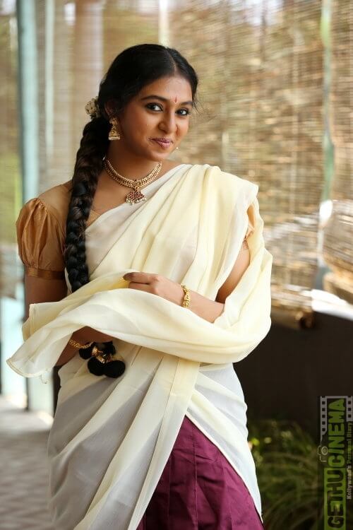 Lakshmi Menon In Purple Skirt With Beige Puffed Sleeves Blouse & Off White Solid Dupatta