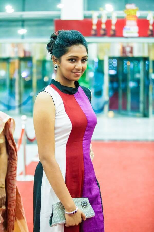 Lakshmi Menon Multicolor Striped High Neck Kurta With Bun Hairstyle