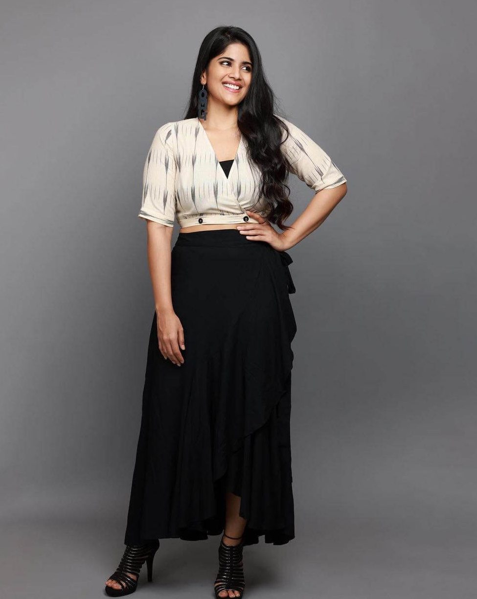 Megha Akash Flattering Look In Cream Wrapped Up Crop Top With Black Ruffled Long Skirt