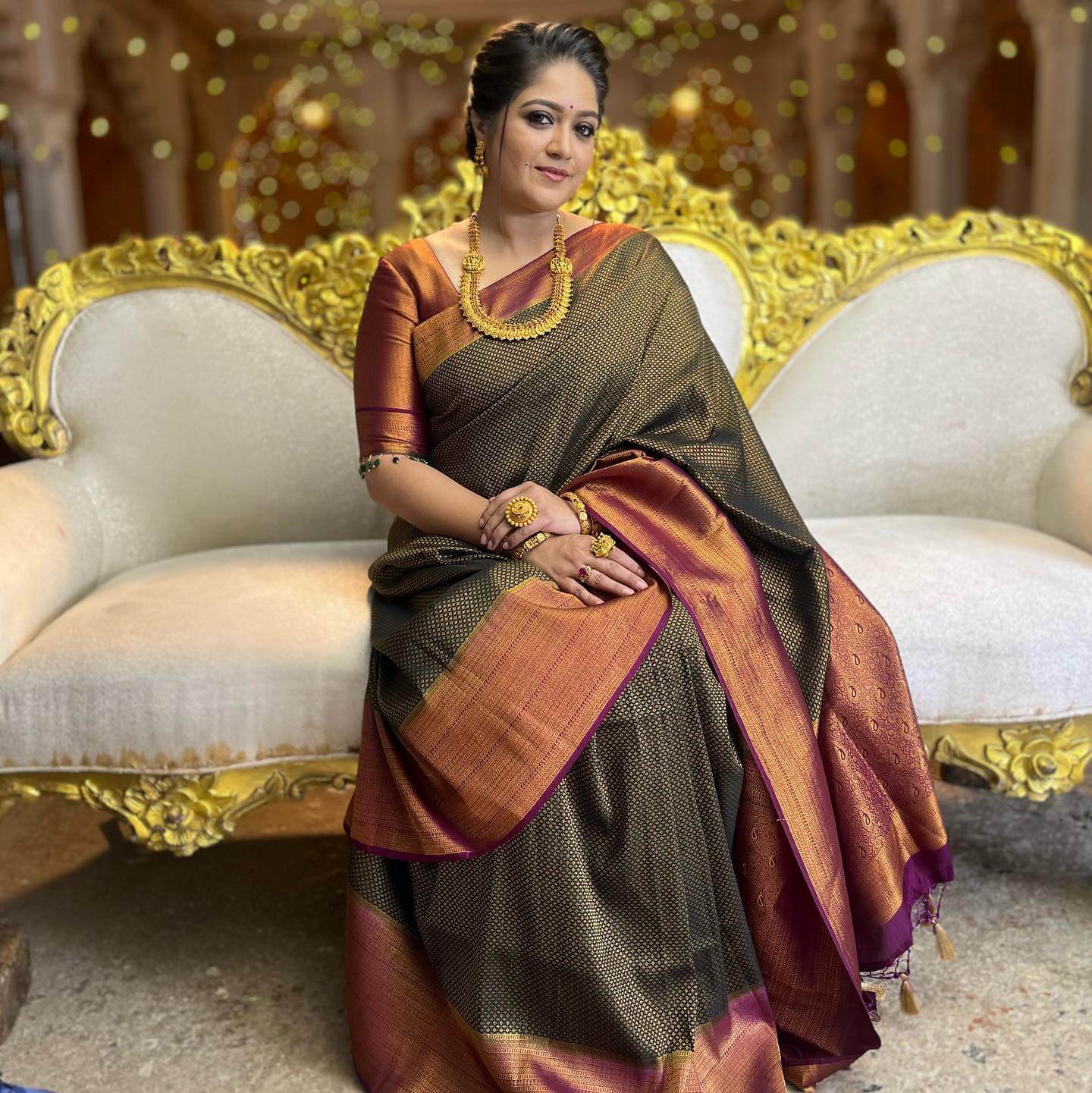 Meghana Raj In Black & Golden Metallic Banarasi Saree Paired With Gold Necklace