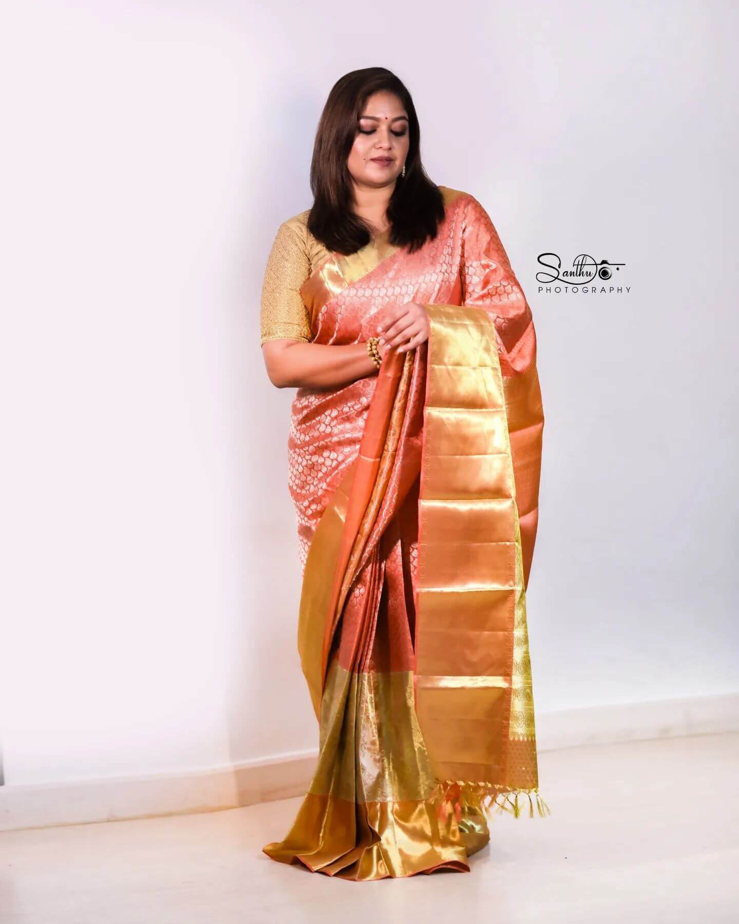 Meghana Raj In Pink & Golden Kanjeevaram Silk Saree