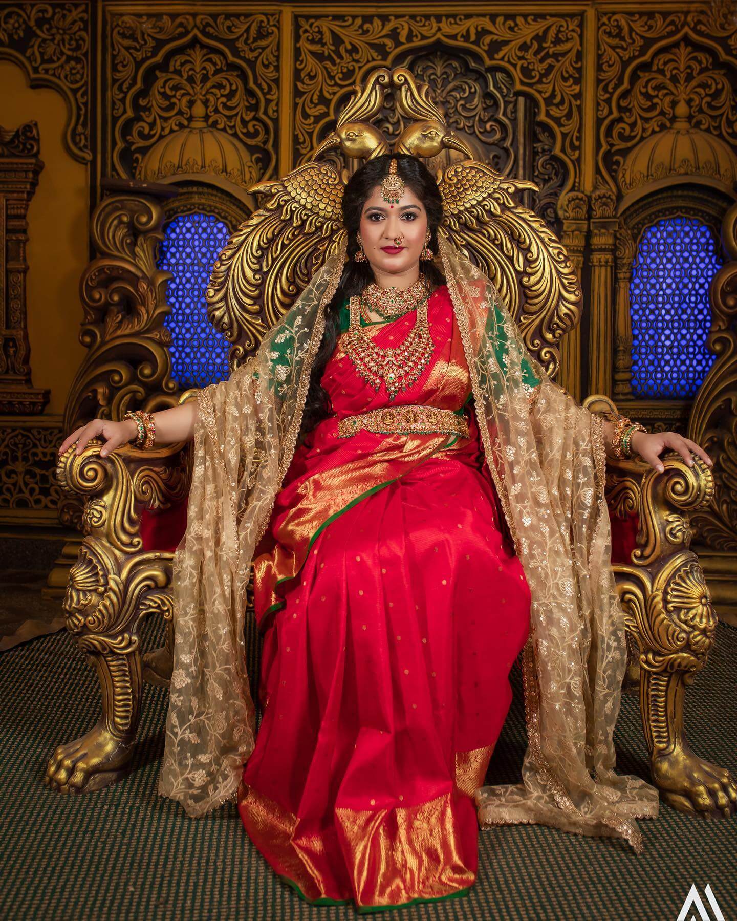 Meghana Raj Maharani Look In Red & Green Saree With Golden Net Dupatta & Heavy Gold Temple Design Jewellery
