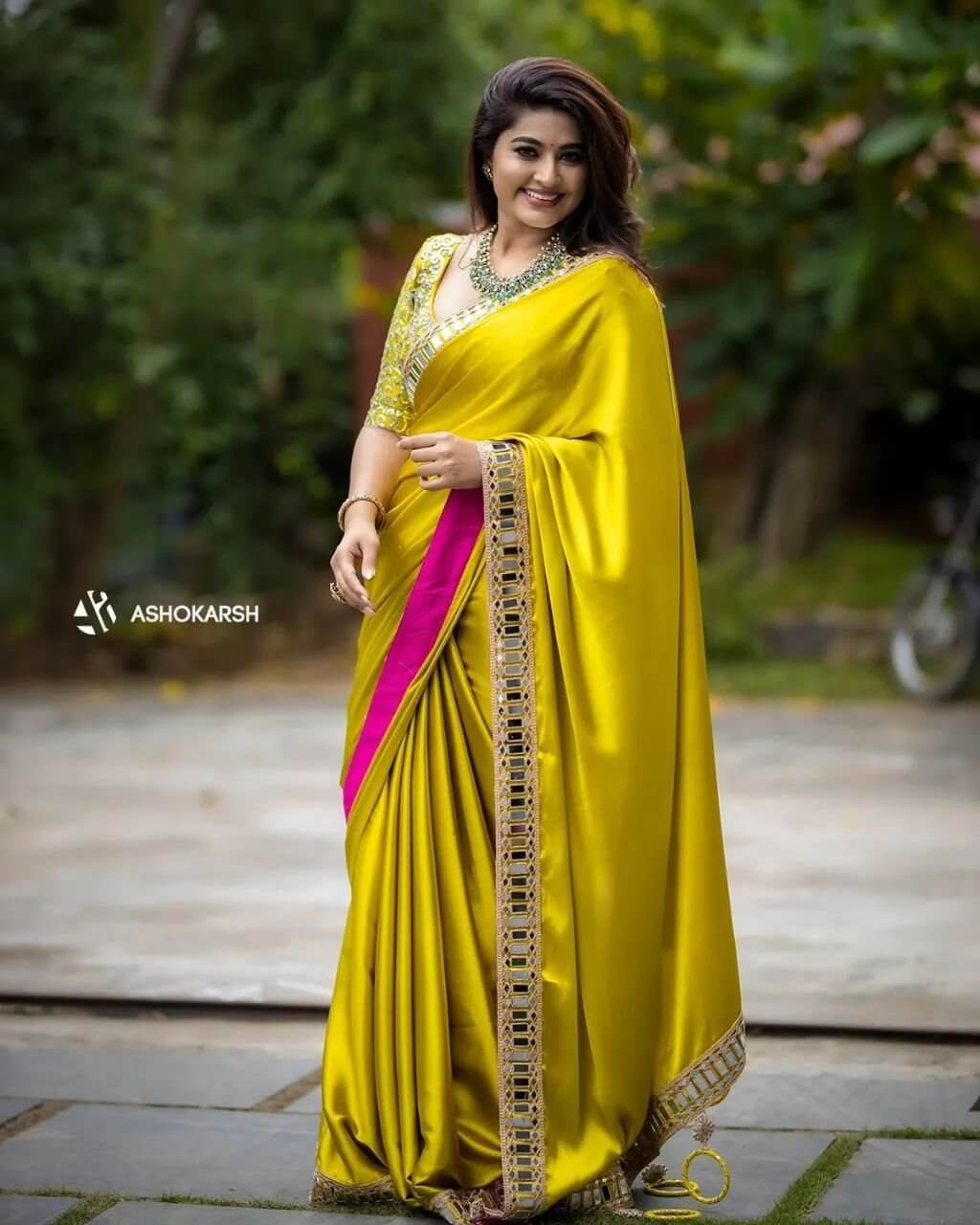 Sneha Mesmerizing Look In Yellow Satin Silk Saree