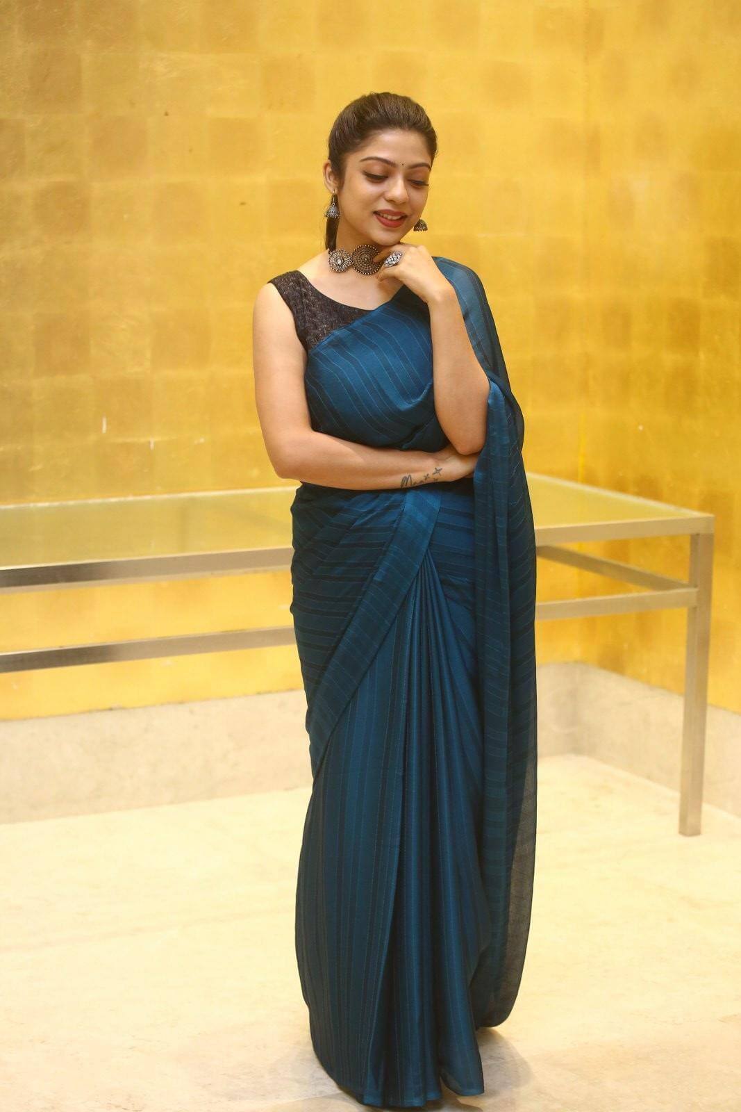 Varsha Bollamma In Peacock Blue Saree Paired With Black Blouse
