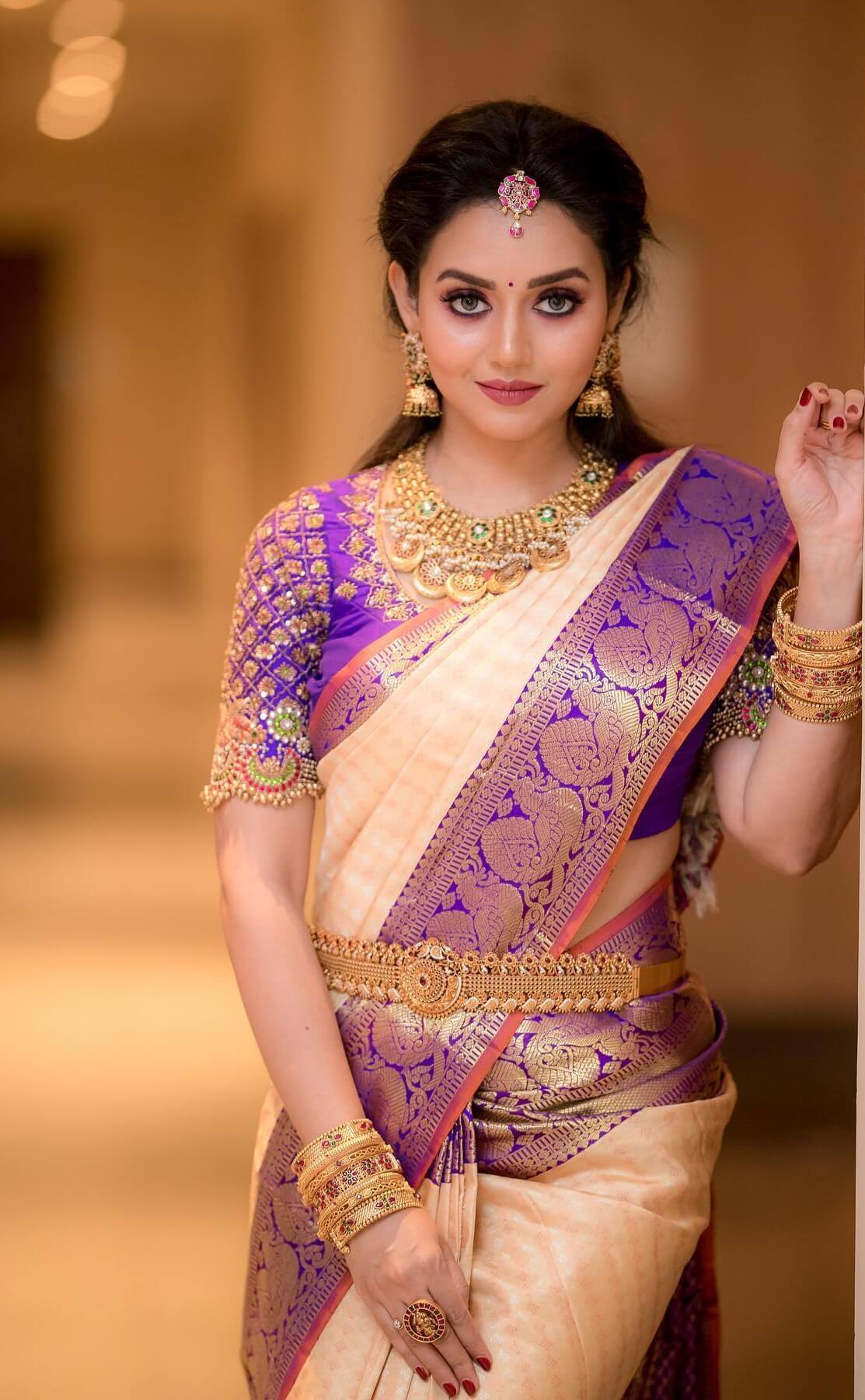 Vidya Pradeep In Beige & Purple Silk Saree & Blouse With Gold Jewellery Set Perfect Traditional South Indian Look