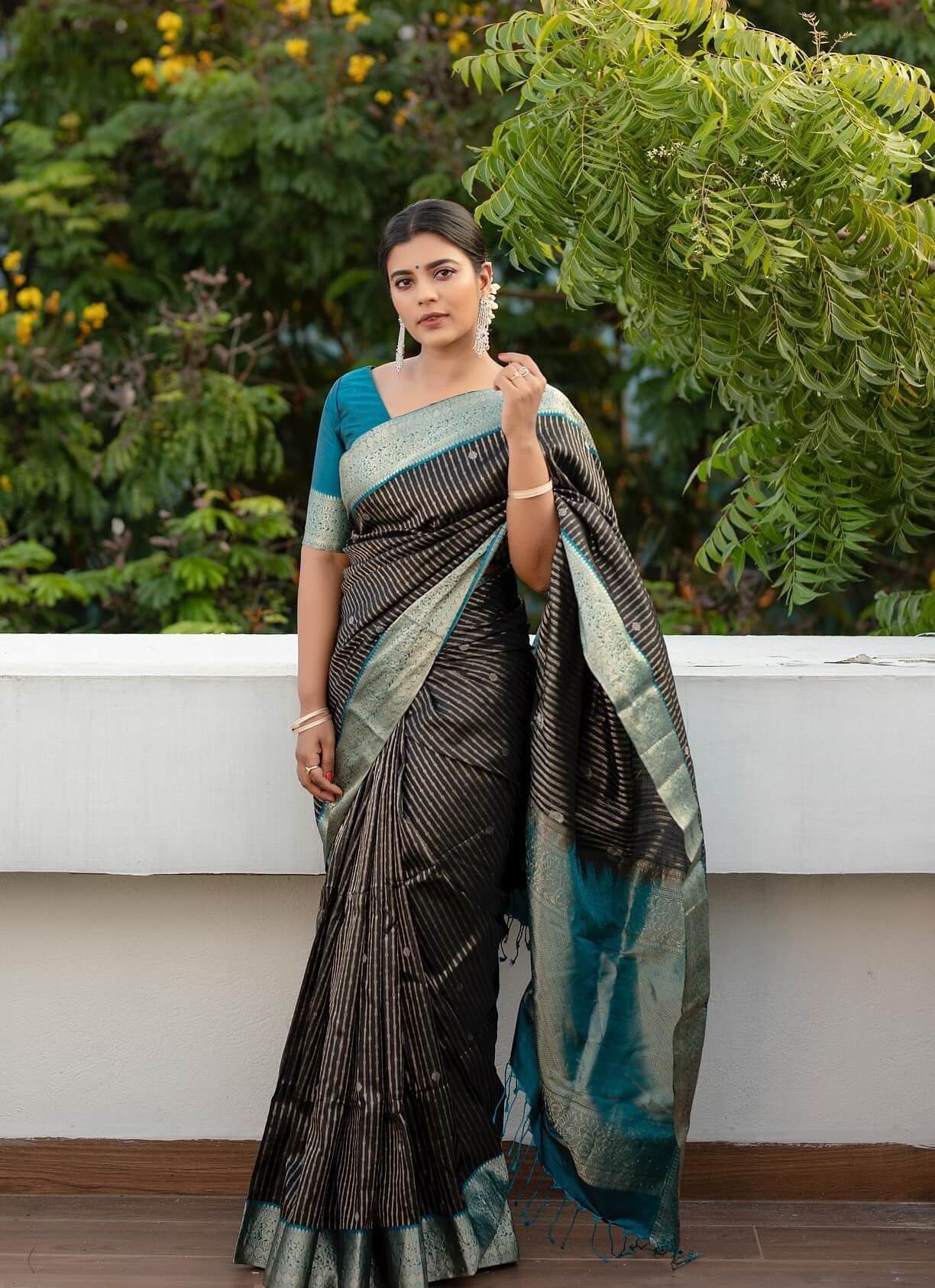 Aishwarya Rajesh In Black & Silver Blended Silk Saree Paired With Blue Blouse