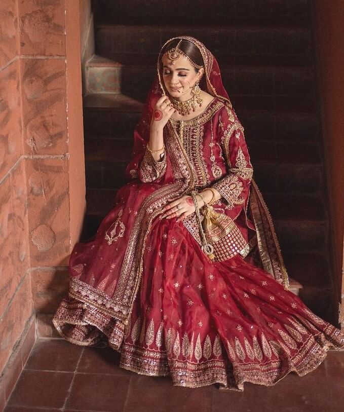 A Timeless Look: Traditional Maroon and Golden Attire for the Muslim Bride
