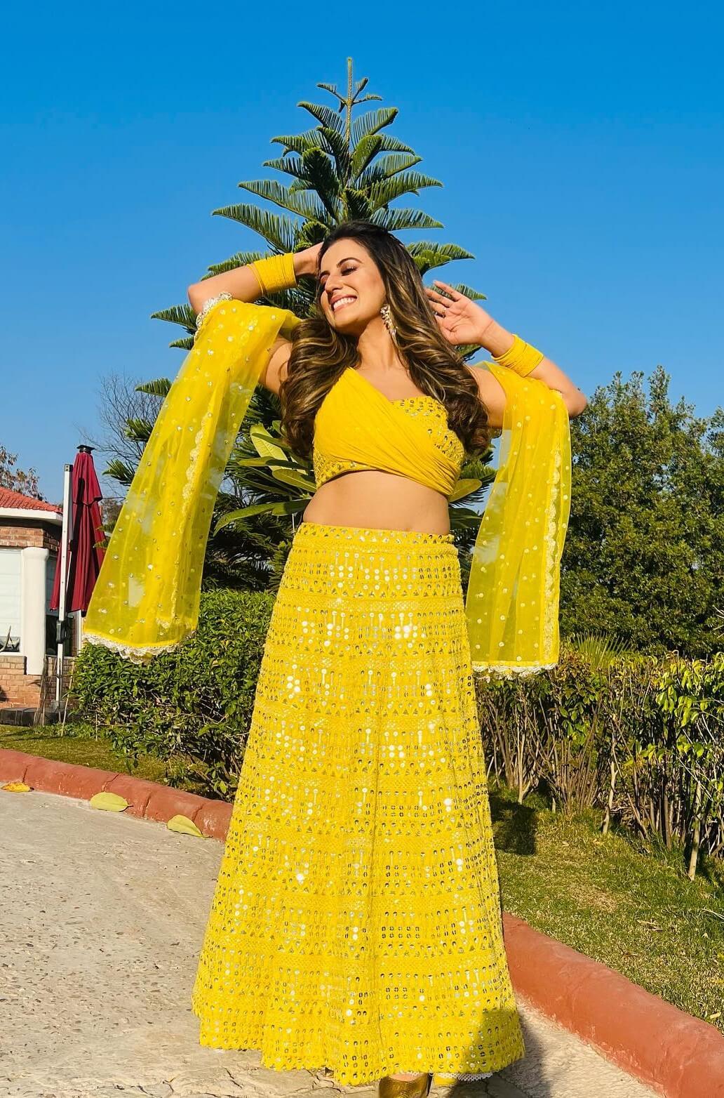 Akshara Singh In Bright Yellow Mirror Work Lehenga With Stylish Designer Blouse