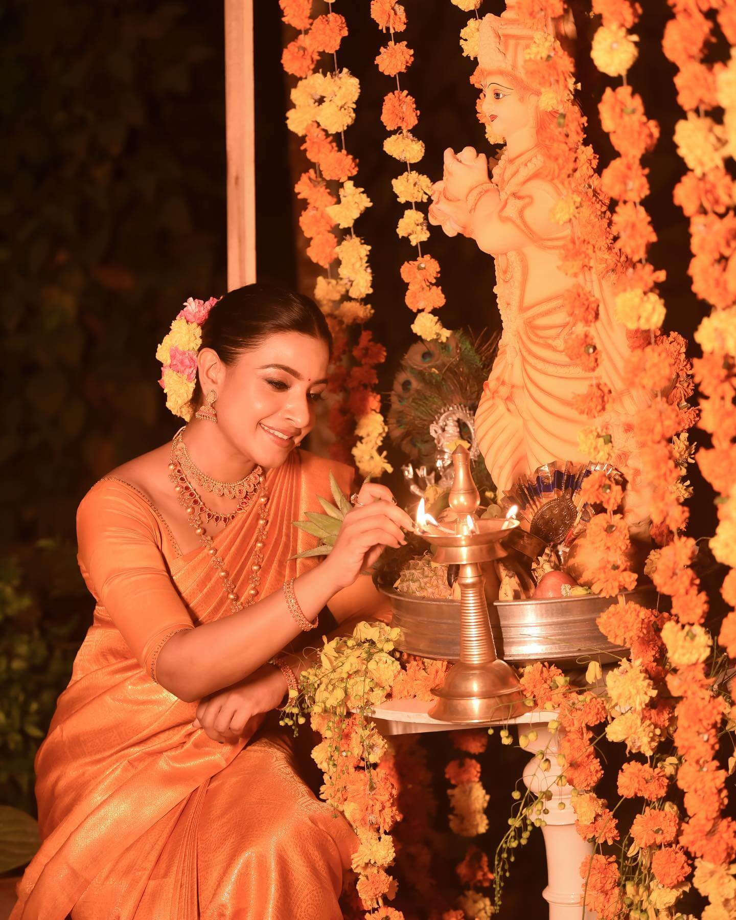 Alphy Panjikaran Gives Us Festive Vibes In Orange Kanjeevaram Silk Saree With Sleek Bun Hairstyle