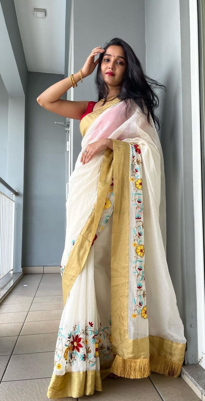 Anikha Surendran Elegant Look In White Floral Embroidery Saree Paired With Red Sleeveless Blouse