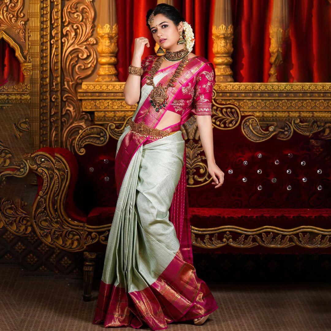 Ashika Ranganath In Traditional South Indian Attire & Look With Pink & Green Kanjivaram Saree & Gold Temple Design Jewellery