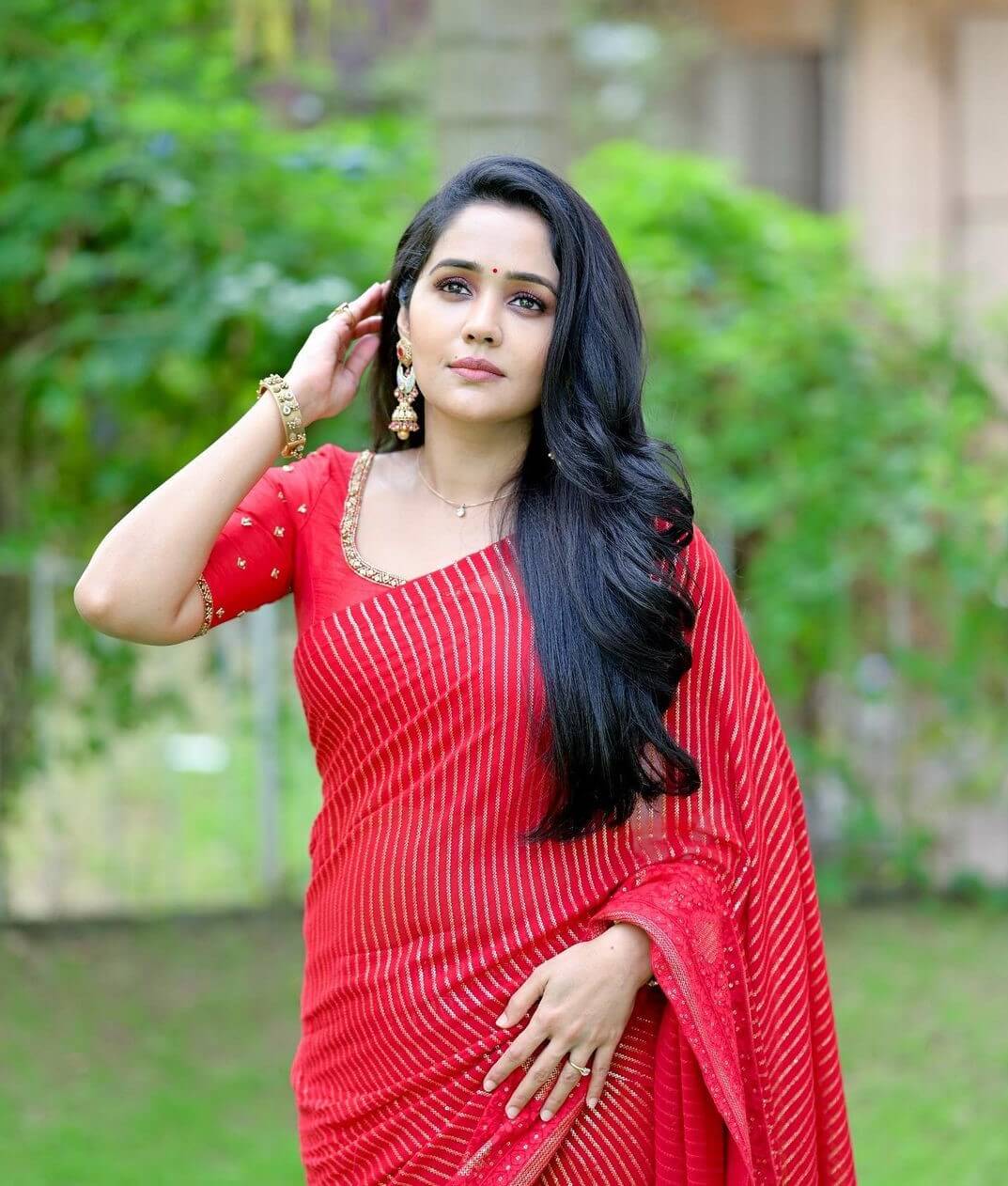 Ayilya Nair Wearing Red Saree With Embroidered Red Blouse All Time Fashionable Outfits Collections