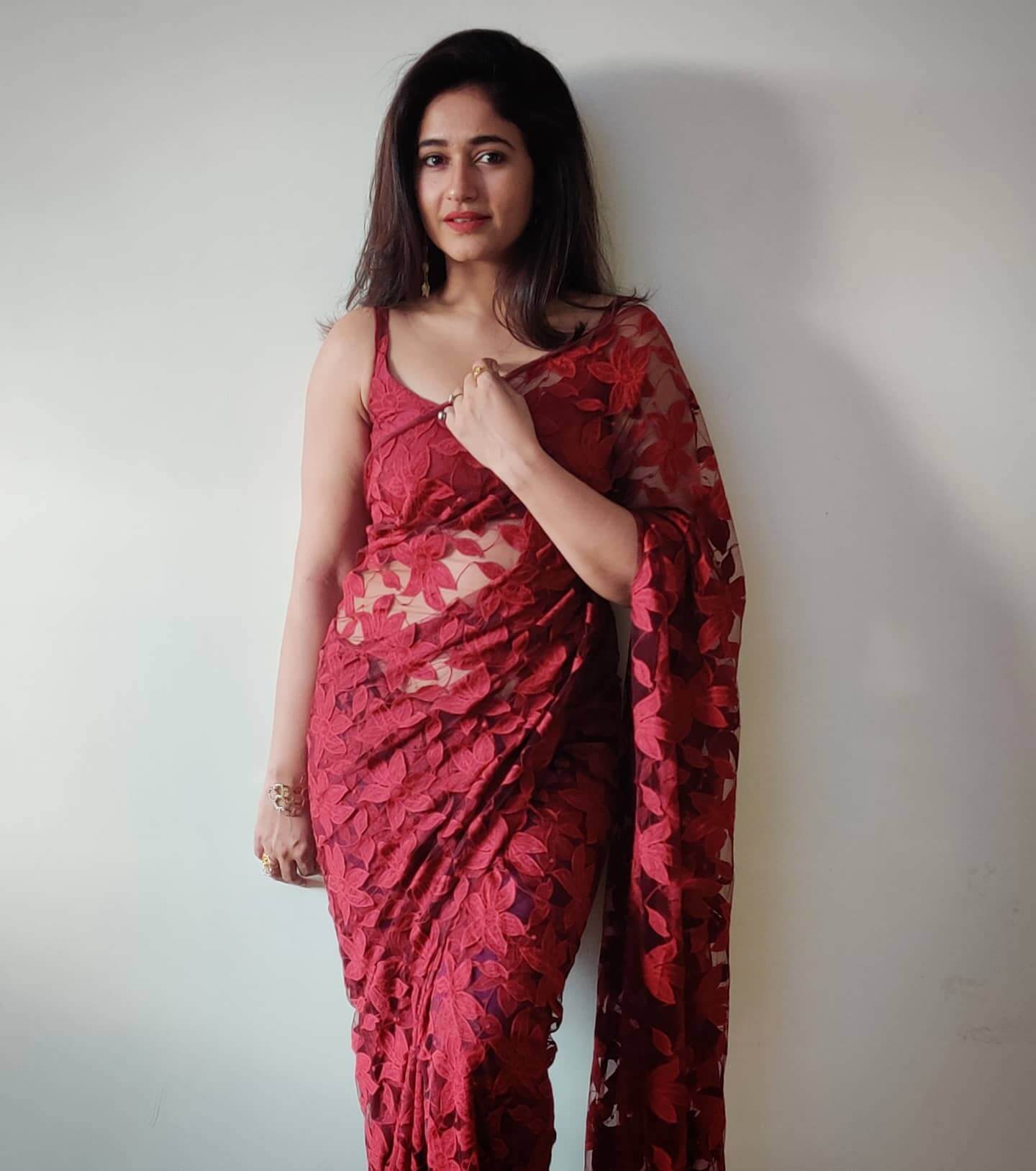 Beautiful Poonam Bajwa  In Red Floral Embroidered Net Saree With Sleeveless Blouse