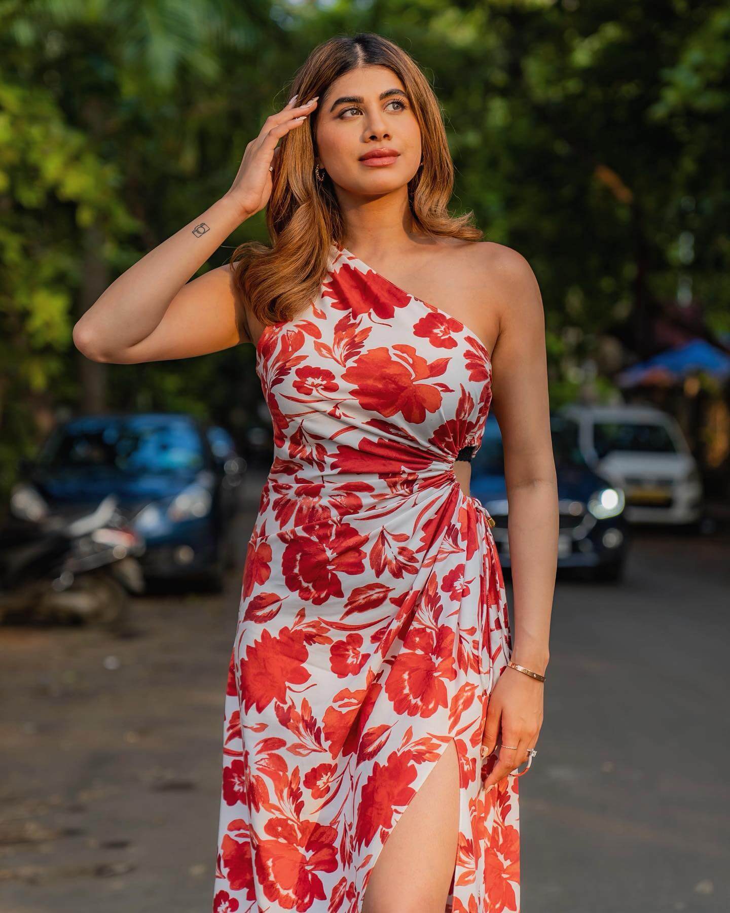 Beauty Content Creator Malvika Sitlani In White & Red Floral Print One Shoulder Cut Out Dress