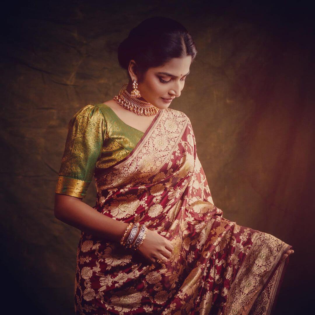 Guna 369 Fame Anagha Maruthora In Festive Maroon Banarasi Zari Woven Saree With Green Silk Blouse