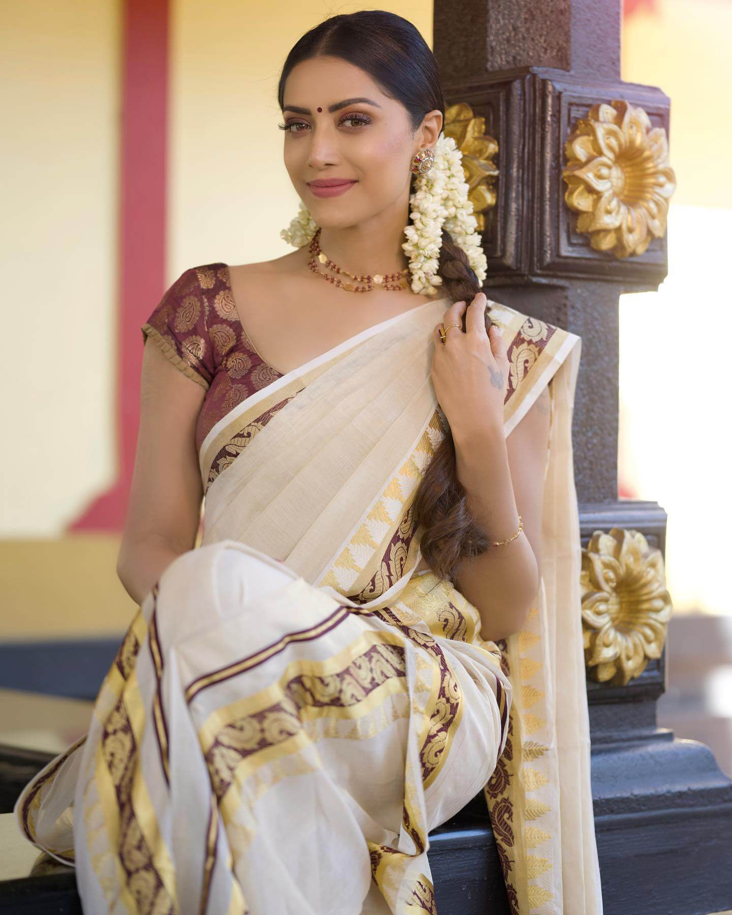 Mamta Mohandas In Ethnic Avtar Wearing White Saree With Mauve Gold Printed Blouse & Braided Hairstyle