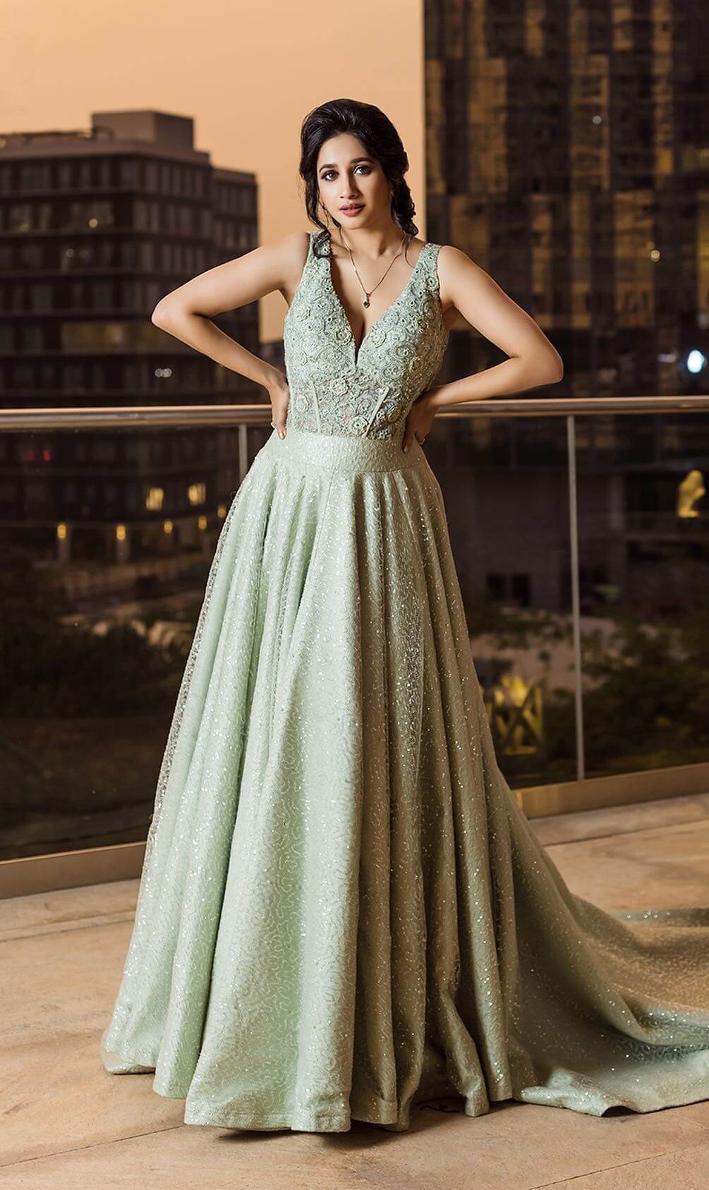 Manvitha Kamath Beautiful Look In Glittery Light Green Deep V- Neck Gown