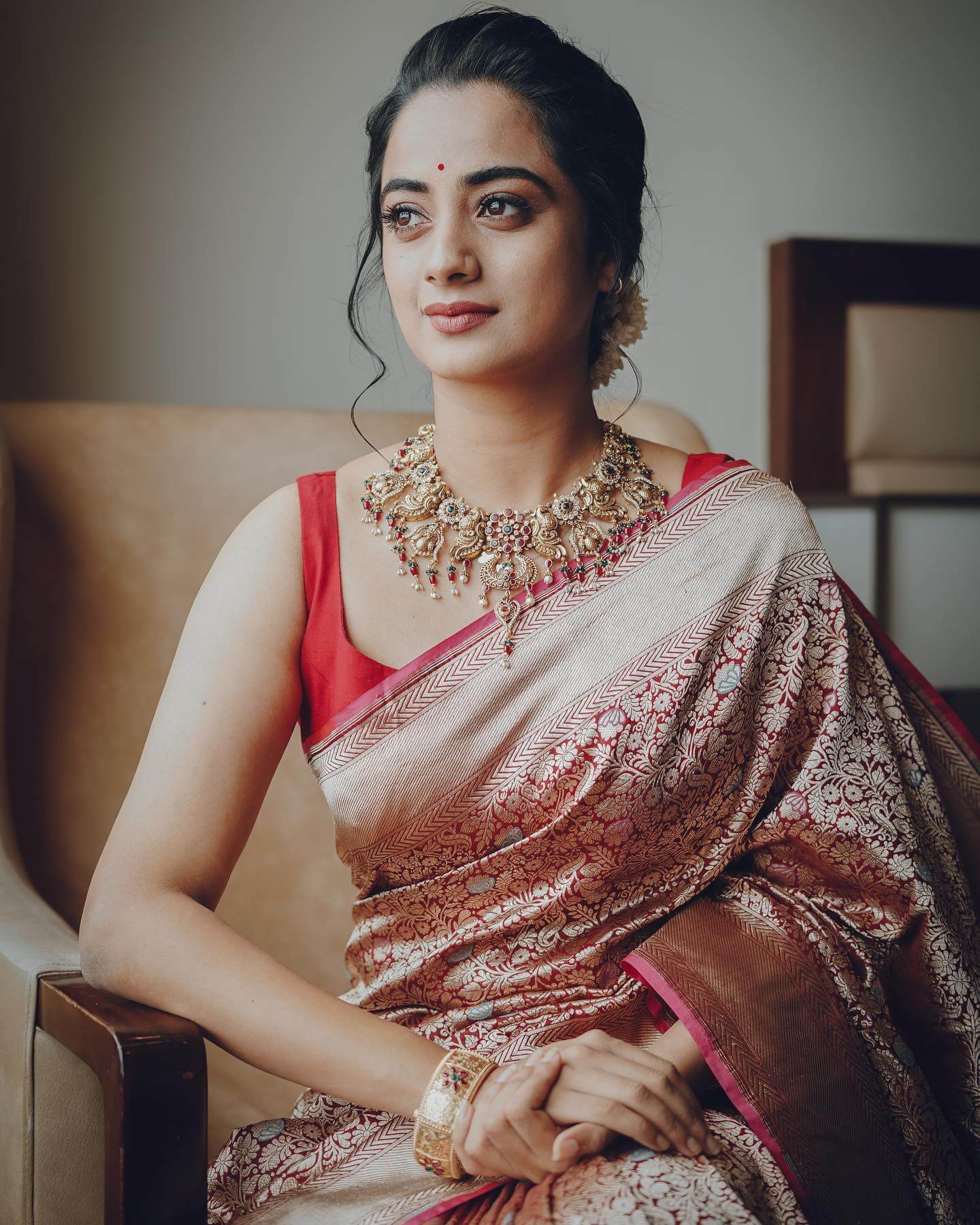 Namitha Pramod In Red Zari Woven Banarasi Silk Saree With Sleeveless Blouse & Golden Jewellery