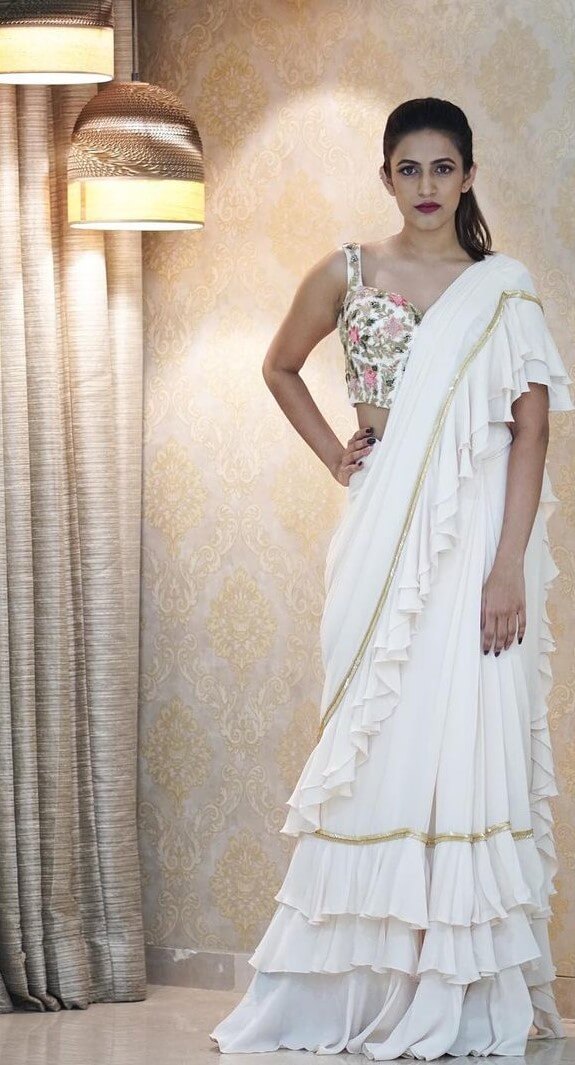 Niharika Konidela In White Ruffled Saree With Embroidered Sleeveless Blouse