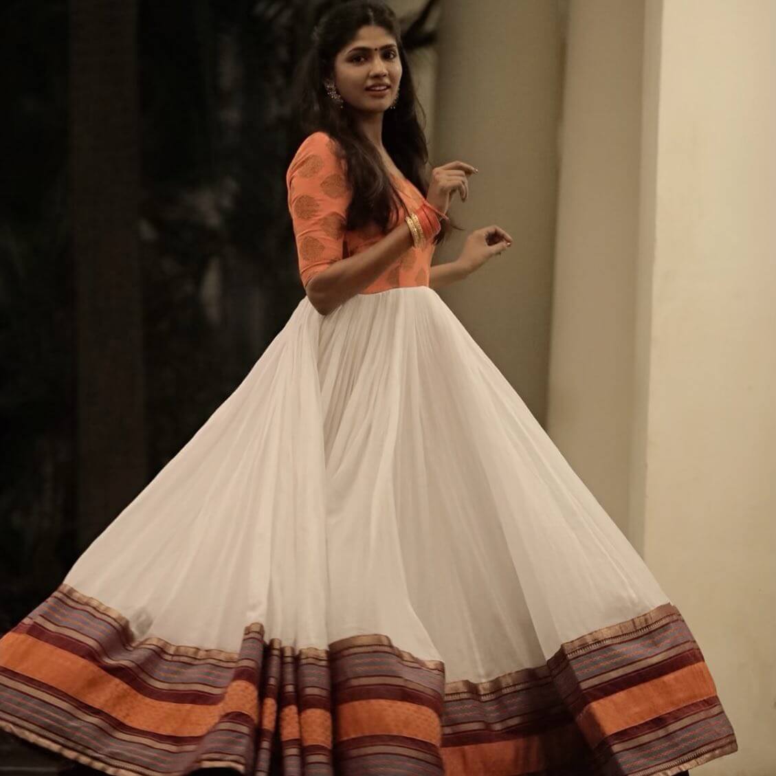 Niranjani Ahathian In Orange & White Full Flared Cotton & Silk Blended Gown With Zari Woven Bottom