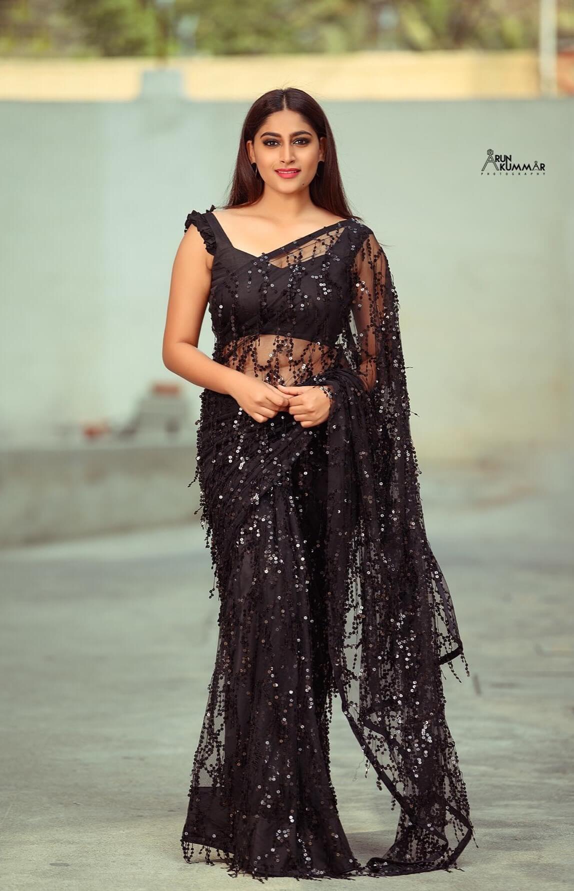 Nishvika Naidu In Black Glittery Net Saree With Sleeveless Blouse