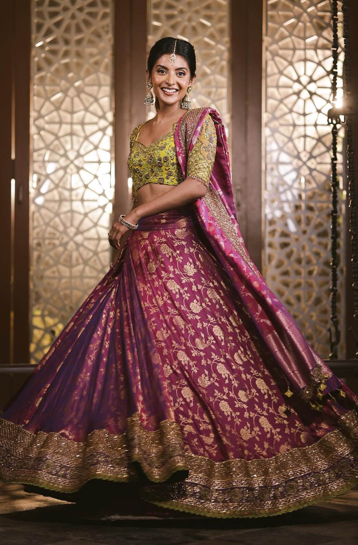 Nivedhithaa Sathish Twirls Beautifully In A Purple Printed  Lehenga With Yellow Embroidered Blouse