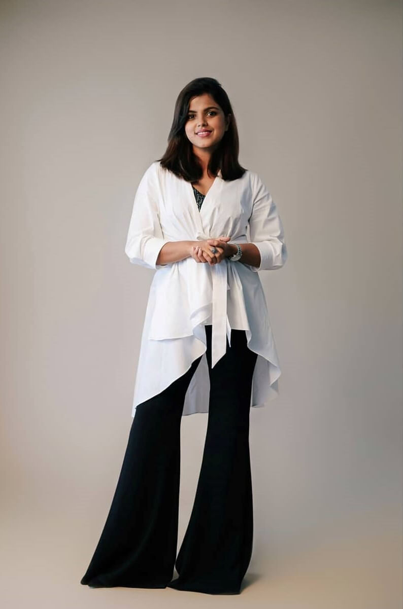 Pooja Devariya Chic Look In White Wrapped Up Dress With Black Flared Pants