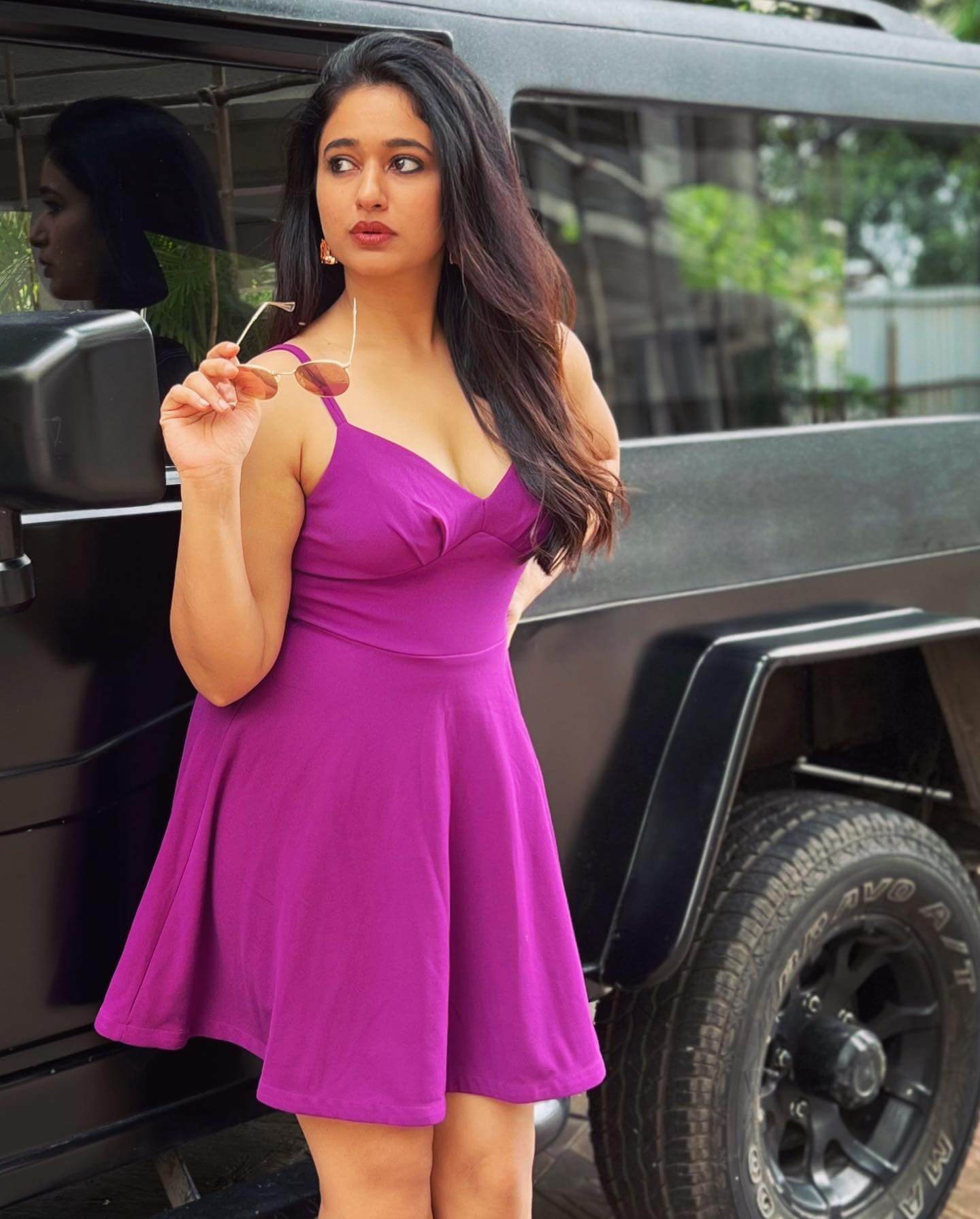 Poonam Bajwa Donning  In Purple Deep Neck Fit & Flare Dress With Sexy Sunglasses