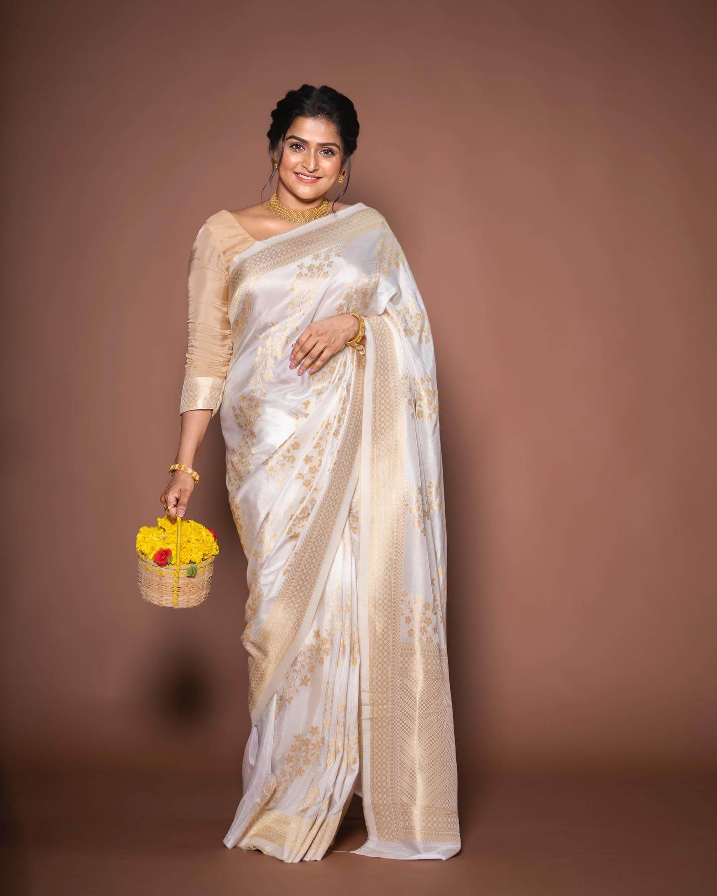 Remya Nambeesan In White & Gold Floral Print Saree Paired With Golden Blouse